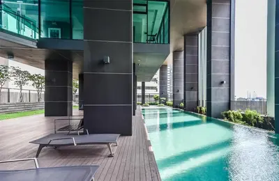 a building with a swimming pool in the middle at 072-Cap-A-R266-F24 in Ban Na Song