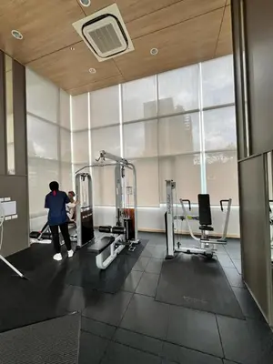 a person exercising in a gym with machines at Lumpini Park Vibhavadi-Chatuchak in Bangkok