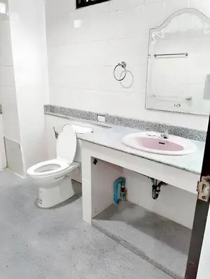 a bathroom with a toilet and a sink at XX Mitr INN Sukhumvit Soi 2 in Bang Kapi