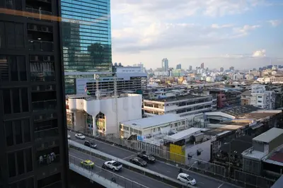 a view of a city with cars on a street at Bangkok City Rama 9 Hotel in Bangkok