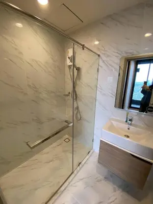 a bathroom with a shower and a sink at Bangna Apartment Ideo in Ban Khlong Samrong