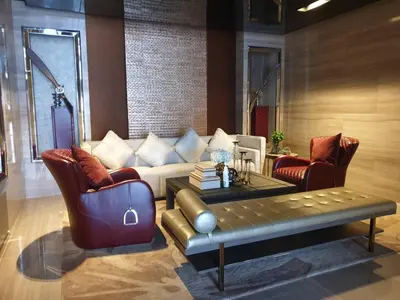 a living room with a couch and two chairs at Ashton Mrt At Bts-Silom Near samyan mitrtown in Bangkok