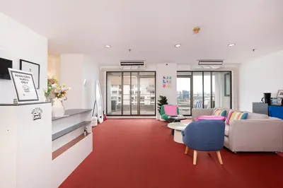 a living room with a couch and a red carpet at Modern Twin BR Bath & Bathtub Retreat BTS BTB6 in Bangkok