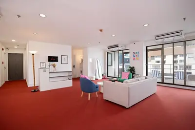 a living room with a couch and a table at Elegant King BR Apt Bathtub, BTS Central BKK BTB8 in Bangkok