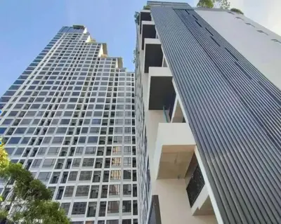 a tall building with many windows on the side of it at Park payathai 28 in Bangkok