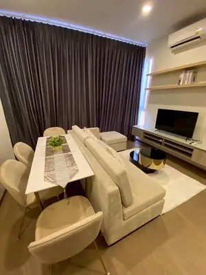 a living room with a couch and a table at origin phayathai 28 in Bangkok