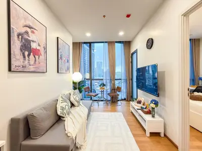 a living room with a couch and a table at New City Condo in Central Bangkok Siam Paragon Central World in Pratunam