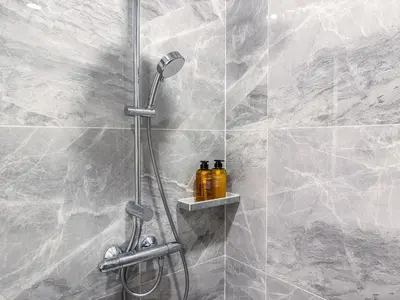 a shower with a shower head in a bathroom at New City Condo in Central Bangkok Siam Paragon Central World in Pratunam