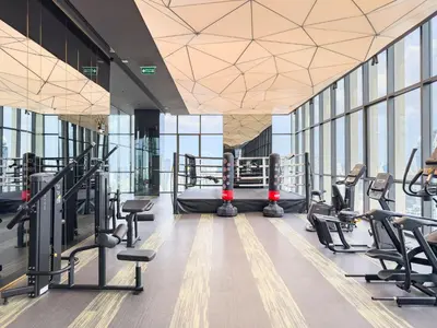 a gym with cardio equipment and treadmills in a building at New City Condo in Central Bangkok Siam Paragon Central World in Pratunam