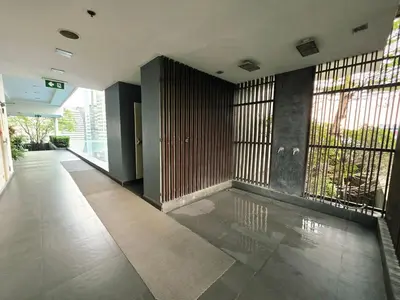 an empty hallway with bars on the windows of a building at Super spacious city view apartment close to King Power Mahanakhon Pixel Building Silom Road Patpong Night Market 2 minutes to BTS rail transit bourgeois lifestyle neighborhood in Bangkok