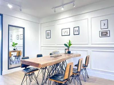 a dining room with a table and chairs at Nortas Tha Phra in Bangkok