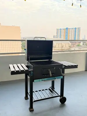 a barbecue grill sitting on top of a roof at Nortas Tha Phra in Bangkok