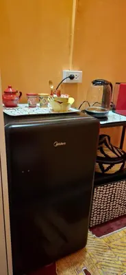 a black refrigerator with a plate on top of it at Dar Wafa Riad, Restaurant and Hamam in Bangkok