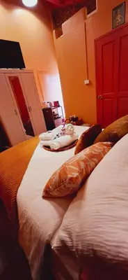 two beds sitting next to each other in a bedroom at Dar Wafa Riad, Restaurant and Hamam in Bangkok
