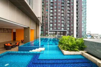 a swimming pool in the middle of a building at Best Western Plus Wanda Grand Hotel in Nonthaburi