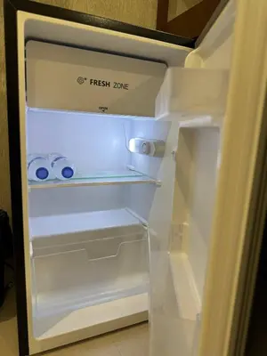 an empty refrigerator with its door open in a kitchen at Thonglor BTS 1-Min Walk Easy Check-In Laundromat in Khlong Toei