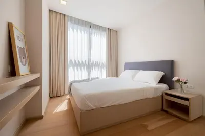 a bedroom with a bed and a large window at 2BR2BA BTS Thonglor Rooftop Pool Gym BBQ Low in Bangkok