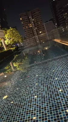 a view of a building at night with tall buildings at MahaNakhon Silom Sathon in the heart of Bangkok in Bangkok