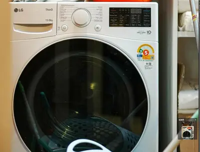 a white washing machine sitting in a kitchen at \u66fc\u8c37\u5e02\u4e2d\u5fc3\u7d20\u5764\u9038\u73b0\u4ee3\u5317\u6b27\u98ce5\u5367\u72ec\u680b\u522b\u5885 in Bangkok