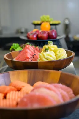 three bowls filled with different types of food on a counter at Marquis Hotel in Ban Bang Toei (1)