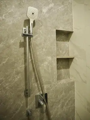 a shower in a bathroom with a shower head at The Crest Park Residences Monthly Rent only #2BR Apartment at Chatuchak #MrtBts in Bangkok