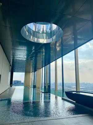 a building with a glass floor with a circular ceiling at The Crest Park Residences Monthly Rent only #2BR Apartment at Chatuchak #MrtBts in Bangkok