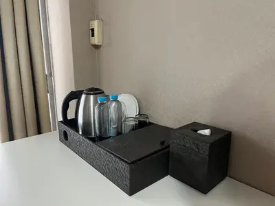 a black tray with bottles and a box at BT fifty in Bangkok
