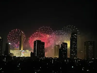 a fireworks display in a city at night at BKK 2 BR apt near Sathon ICONSIAM firework view in Bangkok
