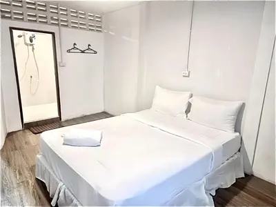a white bedroom with a large white bed and a mirror at xx zNAP Yaowarat - สแนป เยาวราช MRT วัดมังกร in Samphanthawong