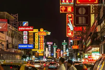 a busy city street at night with neon signs at xx zNAP Yaowarat - สแนป เยาวราช MRT วัดมังกร in Samphanthawong