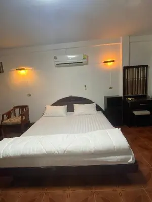 a bedroom with a large white bed in a room at Beautiful 2 story newly renovated bungalow house in Amphoe Phra Khanong