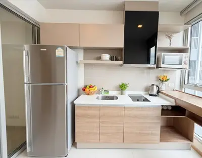 a kitchen with a stainless steel refrigerator and a sink at The Onnut Nest 1BR Sofa Bed Onnut BTS 50m in Bangkok