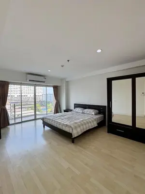 a large bedroom with a bed and a large window at City Living condo at BKK in Bangkok
