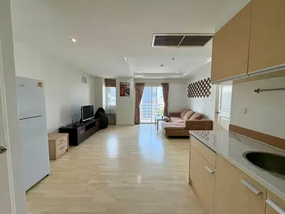 a kitchen and a living room with a couch at City Living condo at BKK in Bangkok