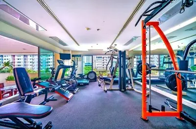 a gym with a bunch of cardio equipment in it at City Living condo at BKK in Bangkok