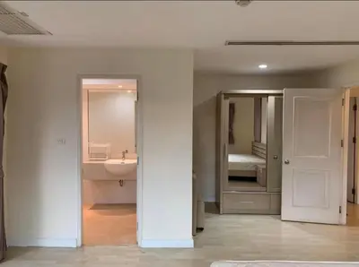 a white bathroom with a sink and a mirror at City Living condo at BKK in Bangkok