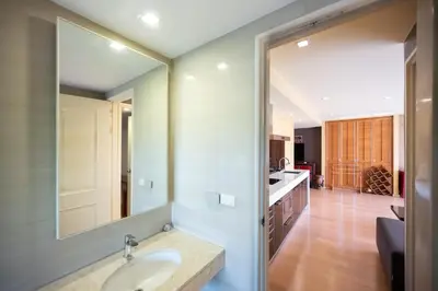a bathroom with a sink and a mirror at Beautiful 1 bed with huge Lumpini park view in Bangkok