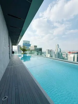 a swimming pool on the roof of a building at Brand New CONDO near Siam Paragon in Pratunam