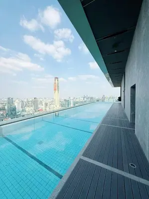 a swimming pool on the roof of a building at Brand New CONDO near Siam Paragon in Pratunam