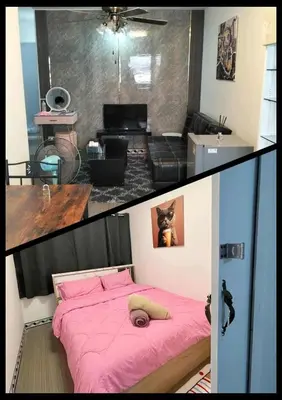 a bedroom with a pink bed and a living room at อิมแพ็ค คอนโดเมืองทอง in Thung Si Kan