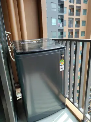 a trash can sitting on a balcony of a building at Apartment in Thon Buri 0 meter From BTS station in Bang Khun Thian