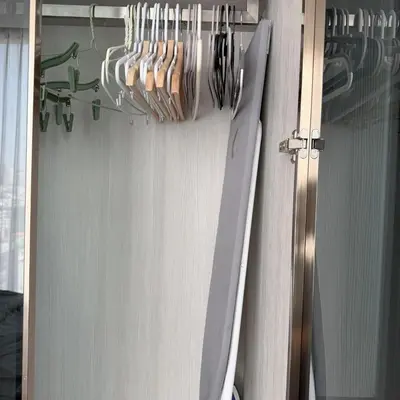 a bunch of utensils are hanging on a wall at Thonglor Ekkamai 10 mins Sky Pool 1BR in Bangkok