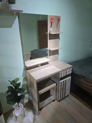 a dressing table with a mirror in a room at 103 Lovely AC apartment with private kitchen in Bangkok