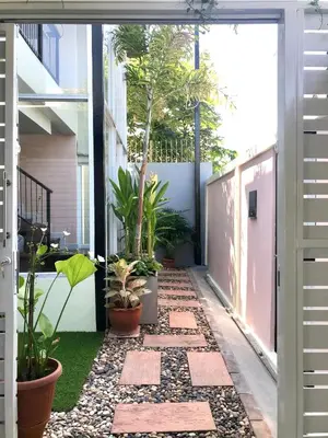 an internal courtyard of a house with plants at Cozy and Convenient Bangna House in Ban Khlong Samrong