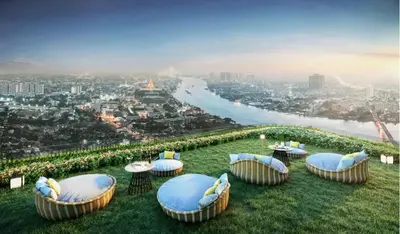 a group of chairs and tables on top of a hill at 2 Bunk bed Lady Room, MRT Bang Pho in Bangkok