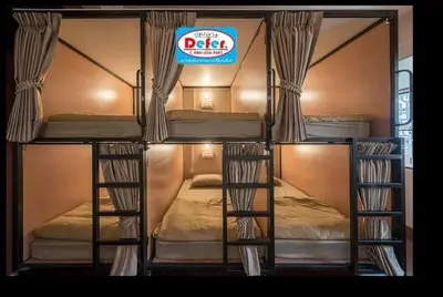 a group of bunk beds with a sign on it at 2 Bunk bed Lady Room, MRT Bang Pho in Bangkok