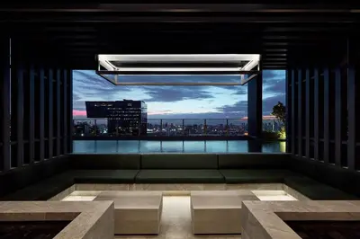 a room with a large window with a view of a city at Spacious 2 Bedrooms at MRT Rama 9 and Central R9 in Bangkok