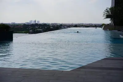 a swimming pool on top of a building at The Politan Aqua in Ban Sai Ma