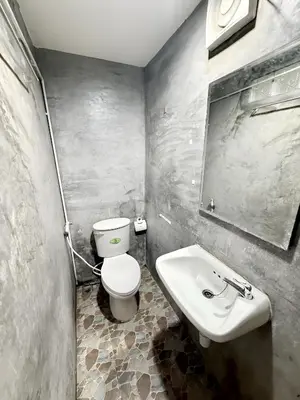 a bathroom with a white toilet and a sink at xx zNap Khaosan - แสนป ข้าวสาร รามบุตรี in Bang Bua Thong Railway Station