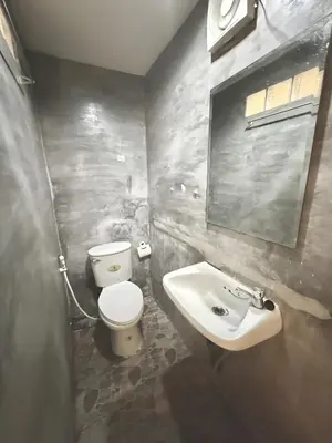 a bathroom with a toilet and a sink at xx zNap Khaosan - แสนป ข้าวสาร รามบุตรี in Bang Bua Thong Railway Station